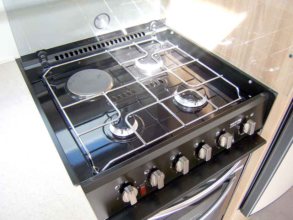 The hob unit with 3 gas burners and 1 electric hotplate.